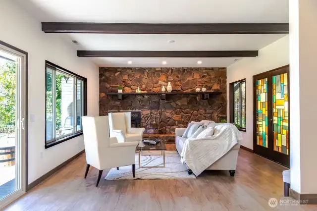 Living room with wood beamed ceilings.