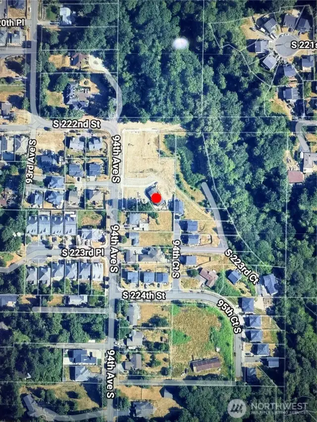 HERE IS AEIRAL VIEW OF LOT LEFT OF RED LOT NEXT TO 94TH AVE S IN NEW DEVELOPMENT