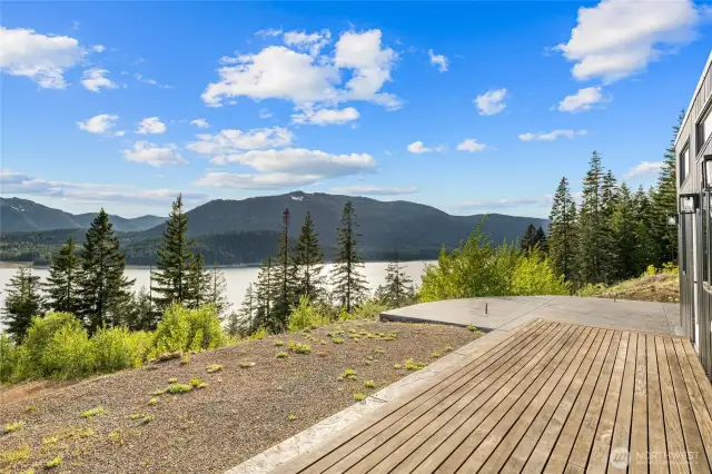 Fantastic front deck and poured patio for outdoor living! Plumbed with propane for your firepit & outdoor kitchen too.