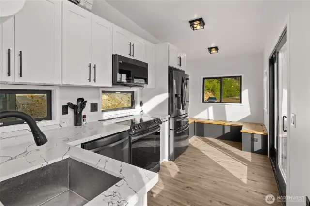 Like new! Full kitchen complete with sink, dishwasher, microwave, stove/range & fridge!
