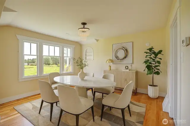 Nice size dining room with lots of light, virtually staged.