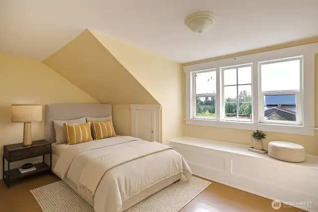Third bedroom on the upper level has a sweet window seat and is virtually staged.