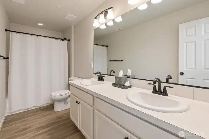 Full upstairs bathroom (Virtually staged)