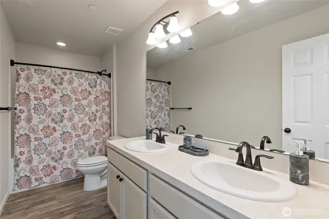 Upper level bathroom to the left of the stairway