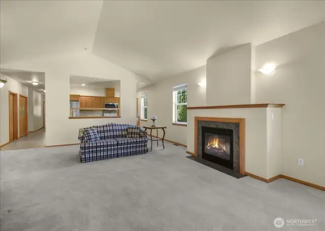 This home features an open floor plan with vaulted ceilings.  The living room has a cozy gas fireplace.