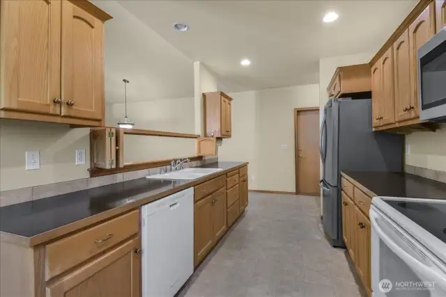 The kitchen has ample counter space and cabinets.  All appliances will remain with the home.