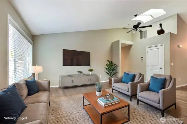 Next to the kitchen you will find your family room, large windows, skylights, cathedral ceilings, beautiful! ***Virtually Staged***