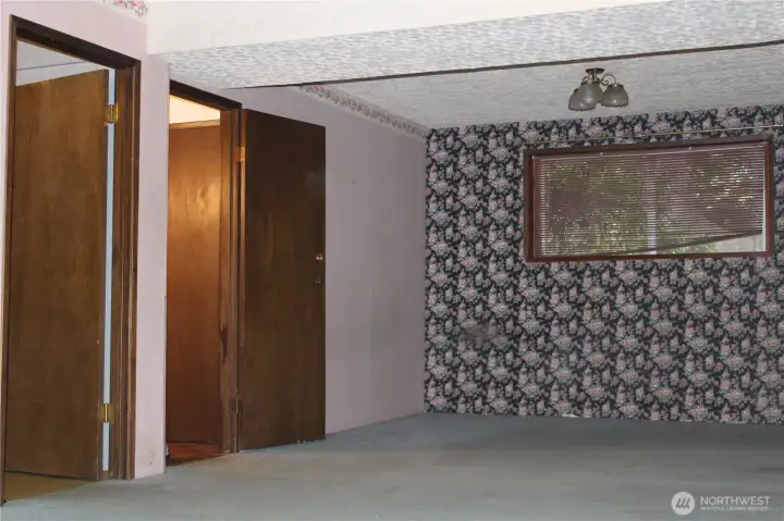 Bonus room entry on right and Laundry/bath door on left