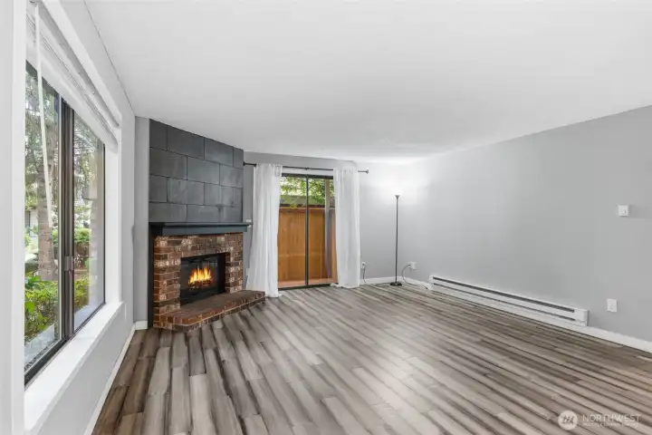 Large windows and a sliding door out to a private deck provide lots of natural light!