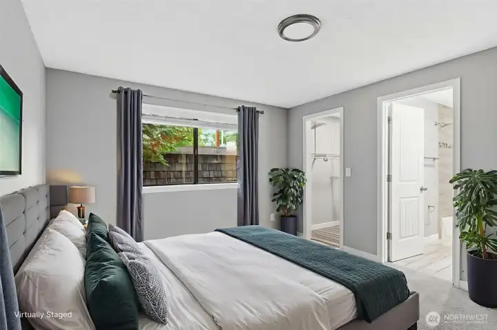 The primary bedroom shown here virtually staged.
