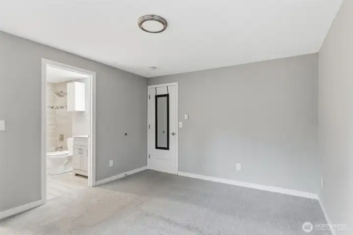 Another view of the primary bedroom and bathroom location.
