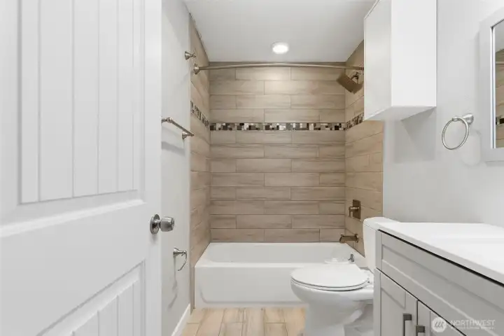 Another view of the stylish tile work in the primary bathroom.