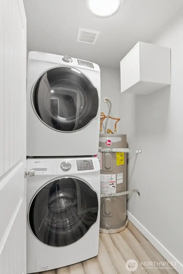 This utility room with included washer/dryer is located in the unit.