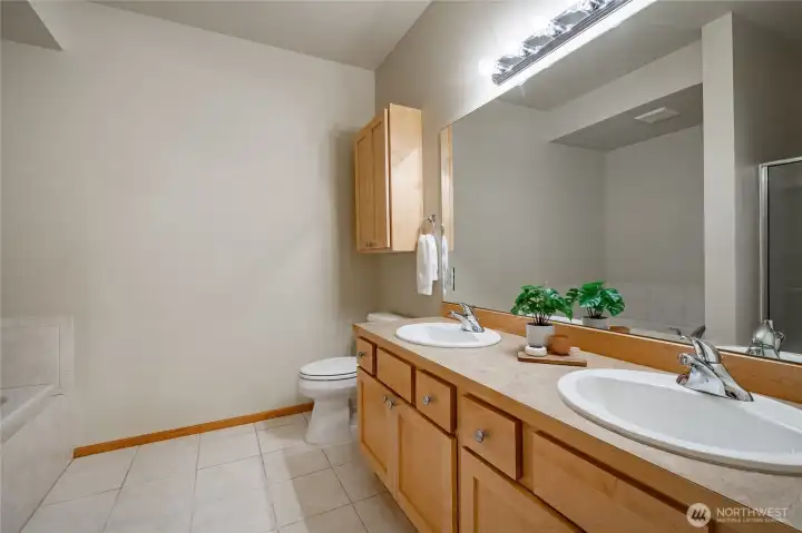 Primary suite bathroom with double vanity