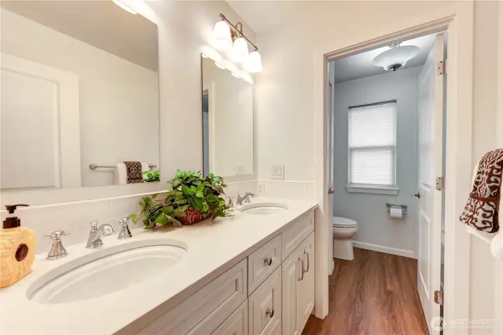 Updated guest bathroom with double sinks.