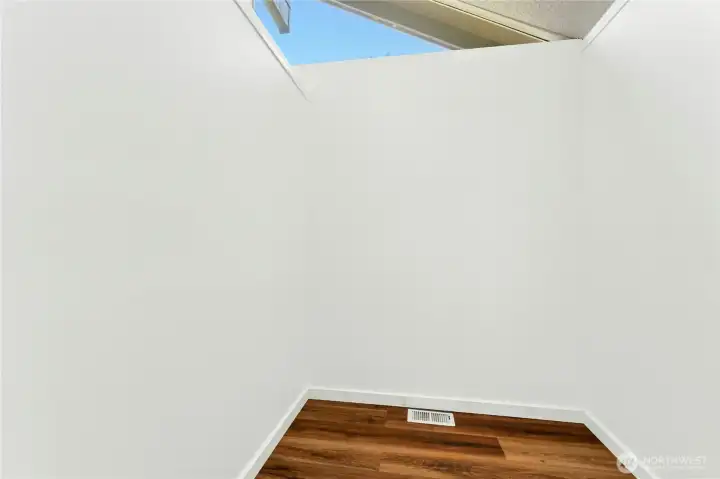 Primary bedroom walk-in closet