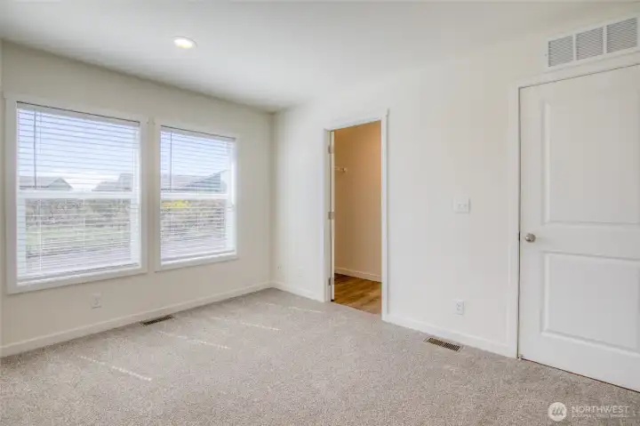 Primary features a walk in closet and ensuite bath.