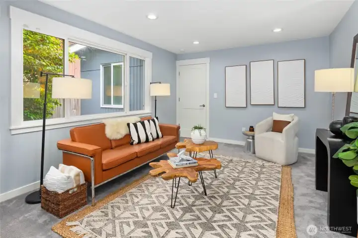 Conveniently located living space off the kitchen, ideal for lounging or watching TV.