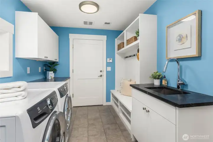 Mudroom off the 3 car garage provides the perfect transitional drop-zone to keep your home clutter-free. 1/2 bath not shown.