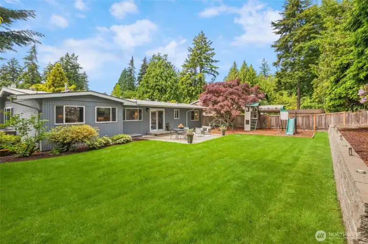 Huge level, park-like lot with patio right off the kitchen/dining room. Great for entertaining!