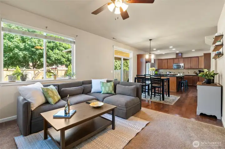 Open-concept living room and eat-in kitchen.