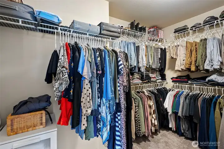 Walk-in closet in primary suite.