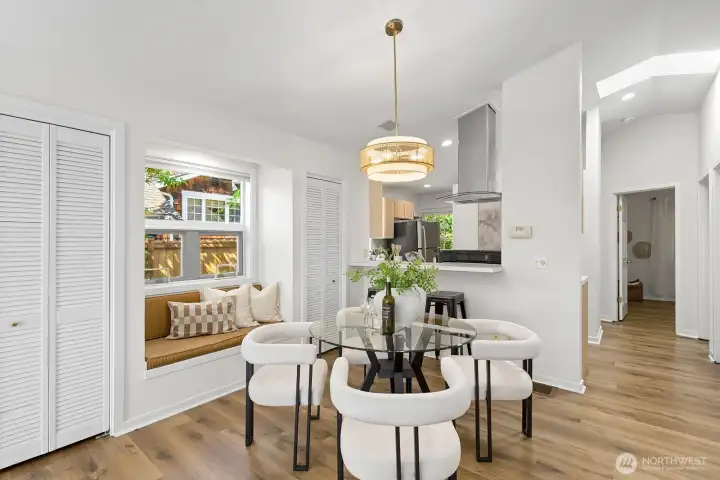 The dining room has a window seat framed by 2 closets.  It's open to the kitchen.