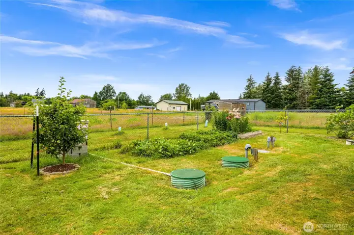 Flower garden with in-ground irrigation water storage