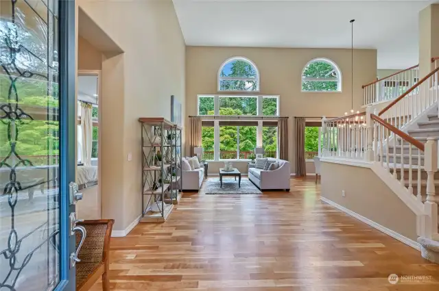 Enter on to newly refinished hardwood floors and you'll be captivated by the wall of windows that frame the greenbelt views.