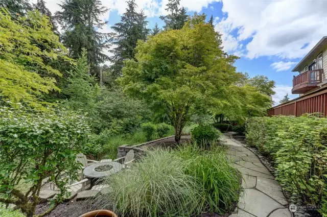 Beautiful stone paths run through the garden and down the sides of the home.