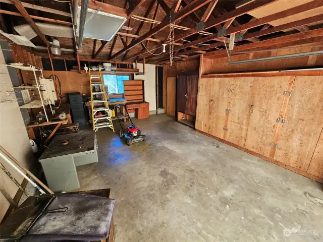 Garage with built-in cabinets.