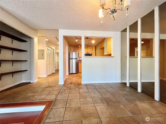 Tile flooring in the dining, kitchen and hall makes cleanup a breeze.