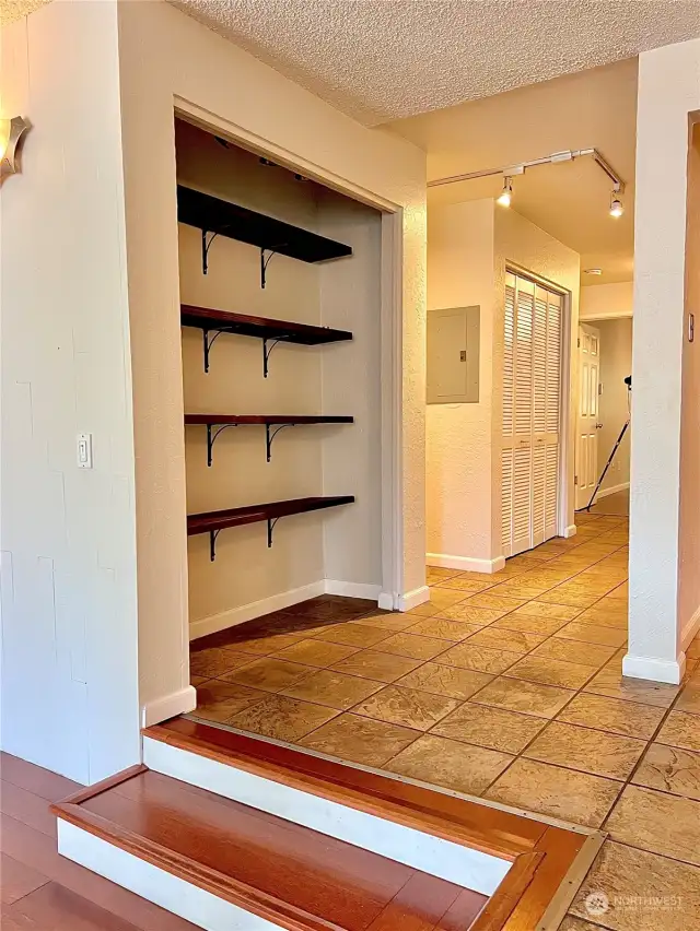 Pantry storage is located by the kitchen.