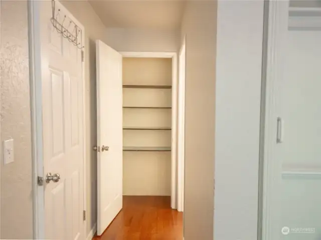 A closer look at the primary bedroom linen closet. Did we mention that this home has LOTS of storage space?