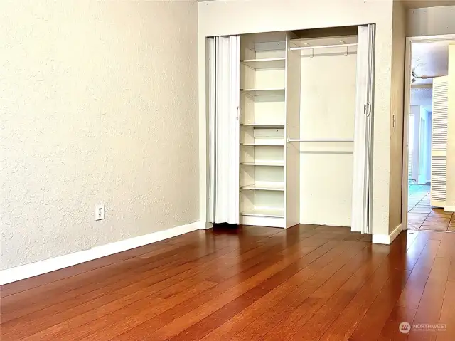 The guest bedroom closet also includes closet organizers.