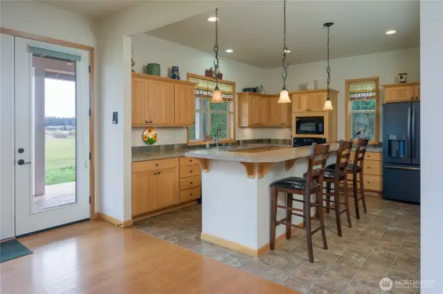 Living area, kitchen, entryway in the back right corner