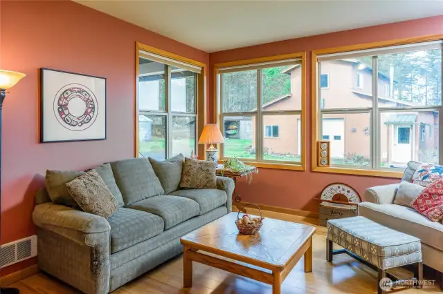 Main house den with barn through windows