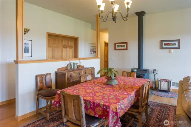 Main house dining area in great room, woodstove in background