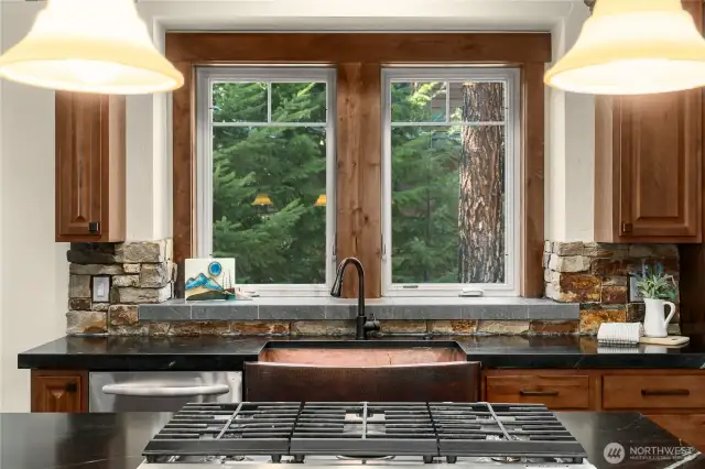 Deep copper sink with a view of the pines!