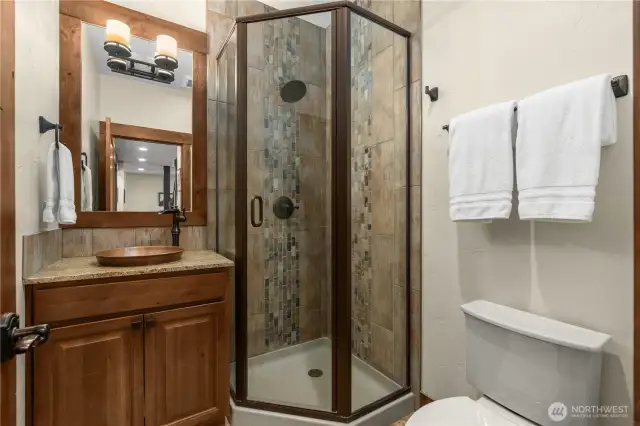 Thoughtfully placed downstairs powder room tucked away from kitchen and dining room.