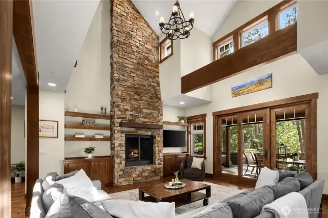 Vaulted ceiling, floor to ceiling rock fireplace, and mega-windows!