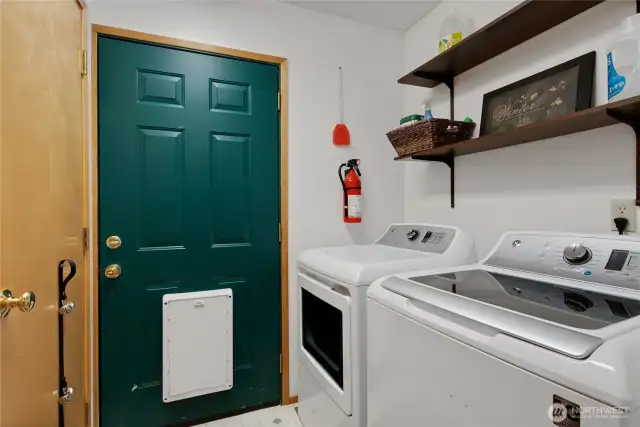 Utility room and back entrance out to dog run.