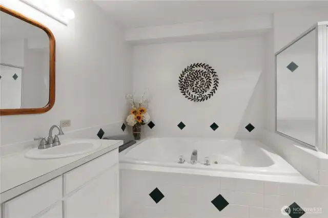 Primary bath with jetted tub and shower.