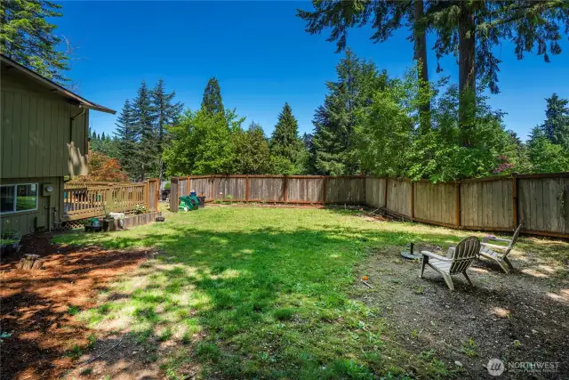 Fully fenced yard and raised garden
