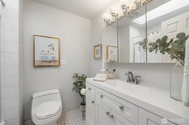 Hall bathroom includes large skylight. The lighting in this bathroom is amazing! So bright!