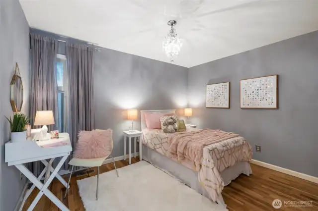 Sweet Secondary bedroom with bling chandelier ceiling light