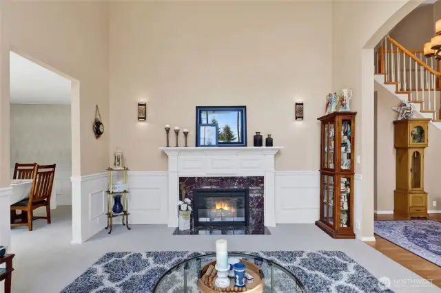 Formal living room with wood burning fireplace.