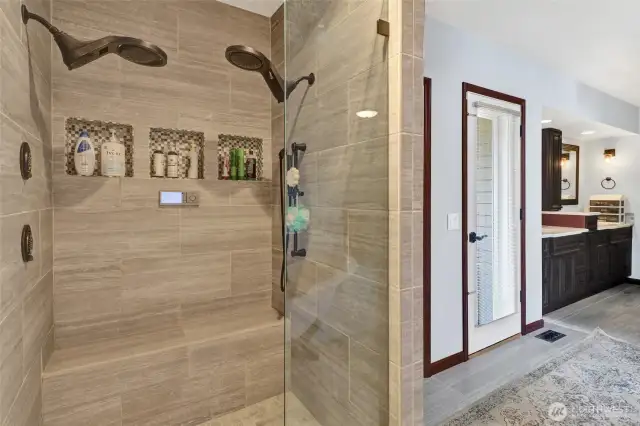 Dual showerheads in primary bathroom.
