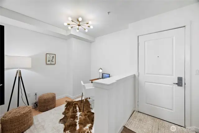 Office right as you enter. Could easily hold a Murphy bed and double as a guest room.