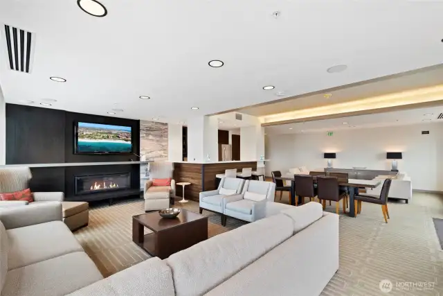 Club room features TV, fireplace, kitchen and dining areas.